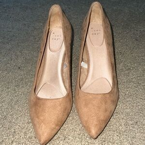 Beige pumps dress up or down! Cute and comfortable inside cushion. Not too high
